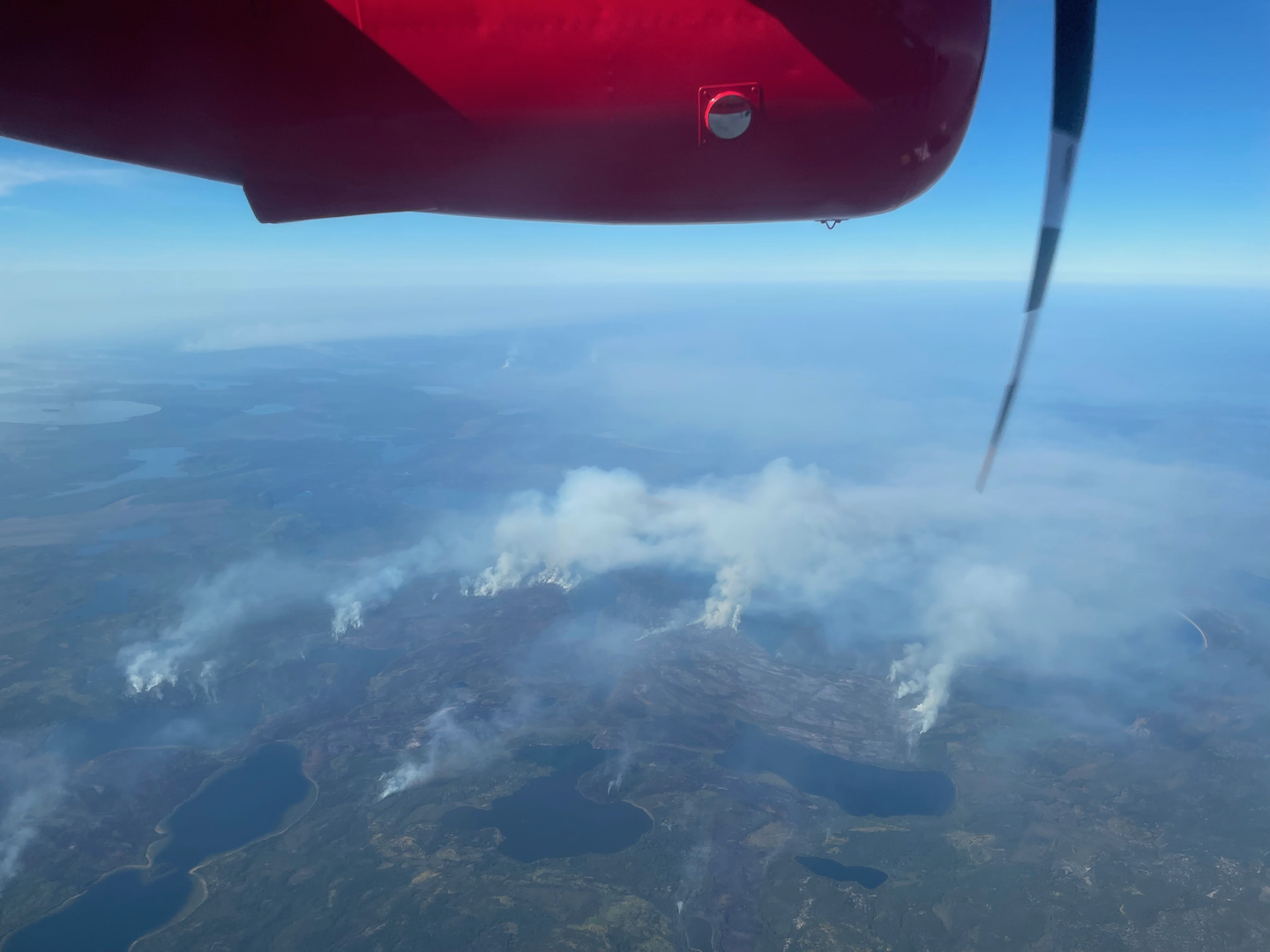 British Antarctic Survey de Havilland Twin Otter over wildfire during the 2024 ESA CarbonARA campaign